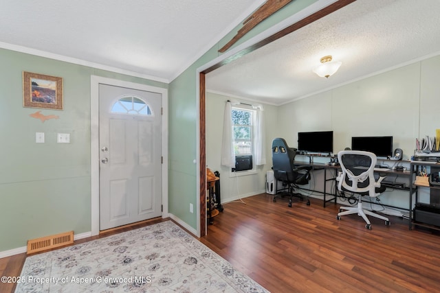 1137 Rose St, Craig, CO 81625 - foyer with wood finished floors, crown molding, lofted ceiling, and a textured ceiling
