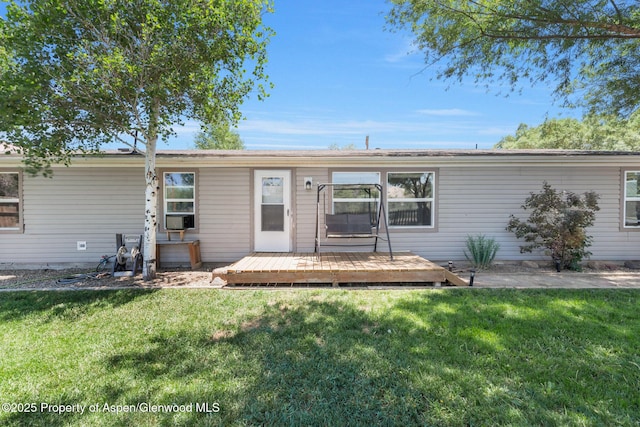 1137 Rose St, Craig, CO 81625 - view of front of house featuring a deck, a front yard, and cooling unit