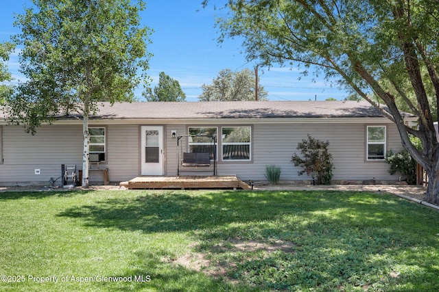 1137 Rose St, Craig, CO 81625 - ranch-style house with a deck and a front yard
