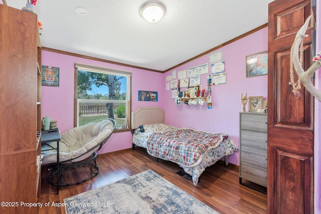 1137 Rose St, Craig, CO 81625 - bedroom featuring ornamental molding, wood finished floors, and a textured ceiling