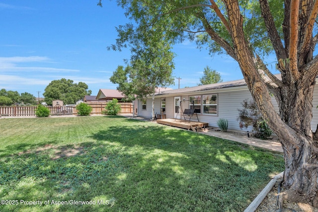 1137 Rose St, Craig, CO 81625 - view of yard featuring a wooden deck