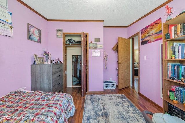 1137 Rose St, Craig, CO 81625 - bedroom featuring crown molding, wood finished floors, and a textured ceiling