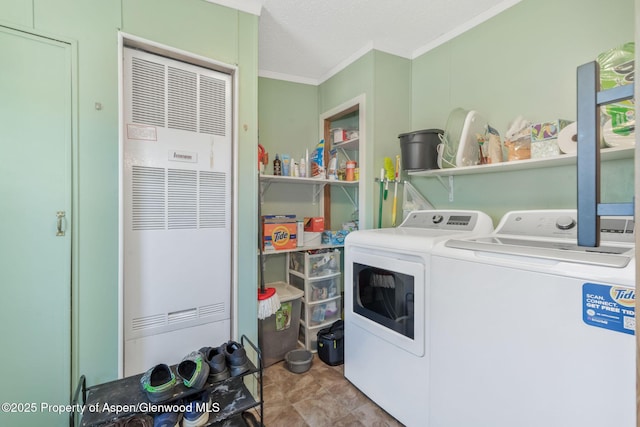 1137 Rose St, Craig, CO 81625 - washroom with a heating unit, independent washer and dryer, and crown molding