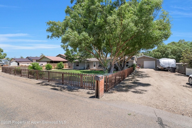 1137 Rose St, Craig, CO 81625 - single story home featuring dirt driveway, a fenced front yard, a garage, and a residential view