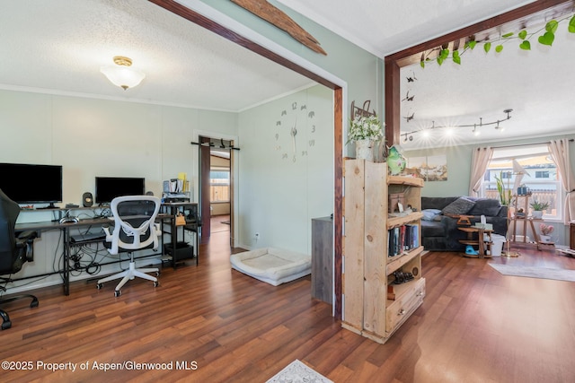 1137 Rose St, Craig, CO 81625 - office area with ornamental molding, wood finished floors, a barn door, and a textured ceiling