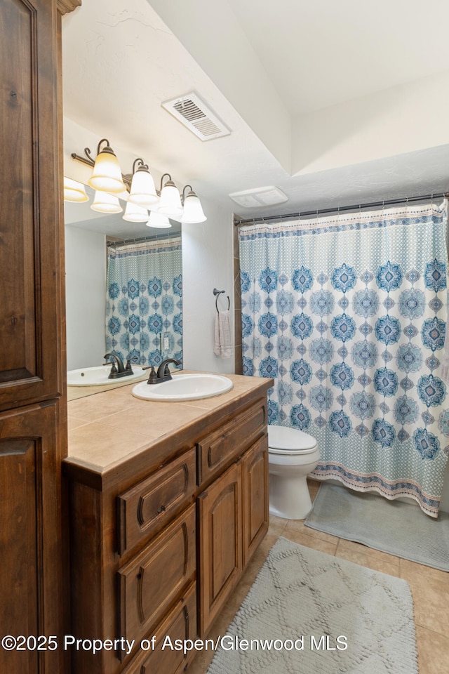 1468 W Main St, Carbondale, CO 81623 - bathroom featuring toilet, tile patterned floors, vanity, and curtained shower