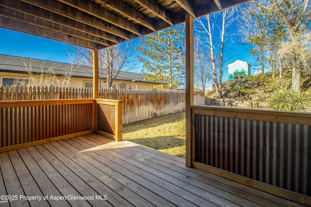 deck with a fenced backyard