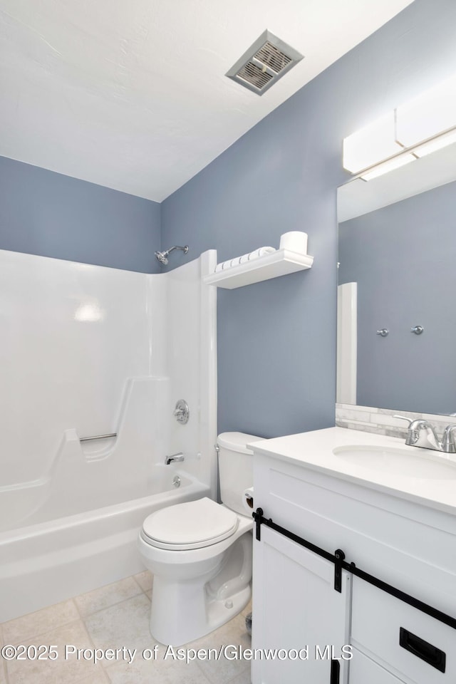 bathroom featuring vanity, washtub / shower combination, visible vents, tile patterned flooring, and toilet