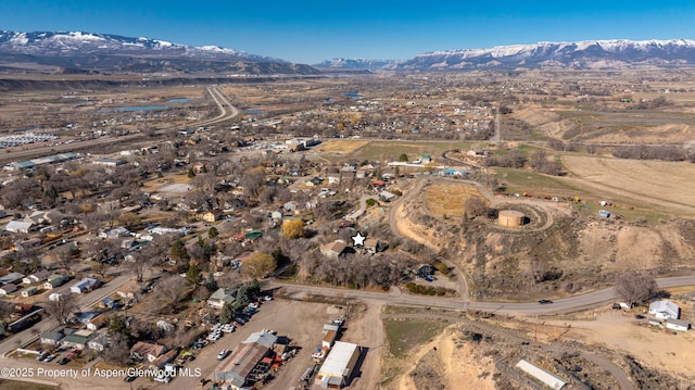 birds eye view of property with a mountain view