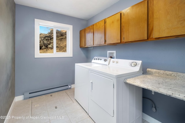 washroom featuring cabinet space, separate washer and dryer, light tile patterned floors, a baseboard radiator, and baseboards