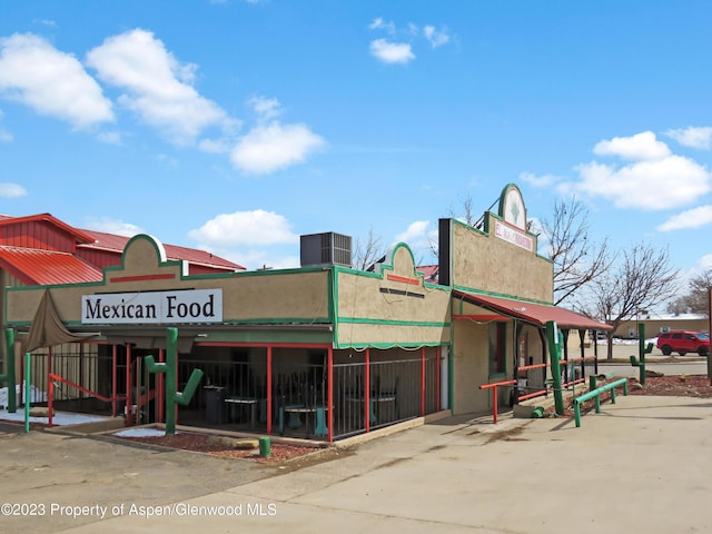 view of building exterior featuring central AC