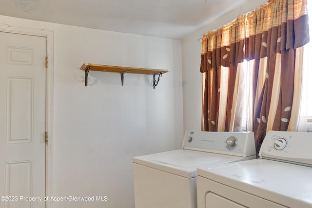 washroom with washer and dryer