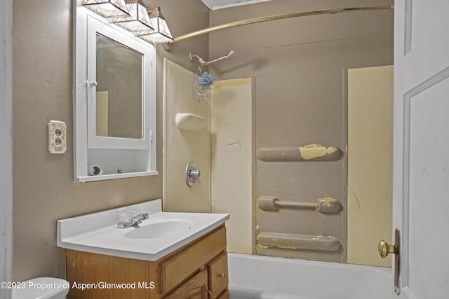 full bathroom featuring vanity, toilet, and  shower combination