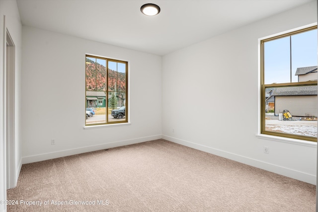 unfurnished room with carpet floors