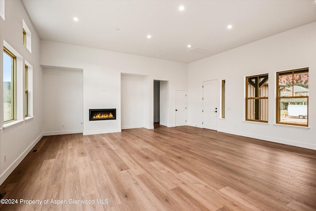 unfurnished living room with light hardwood / wood-style floors