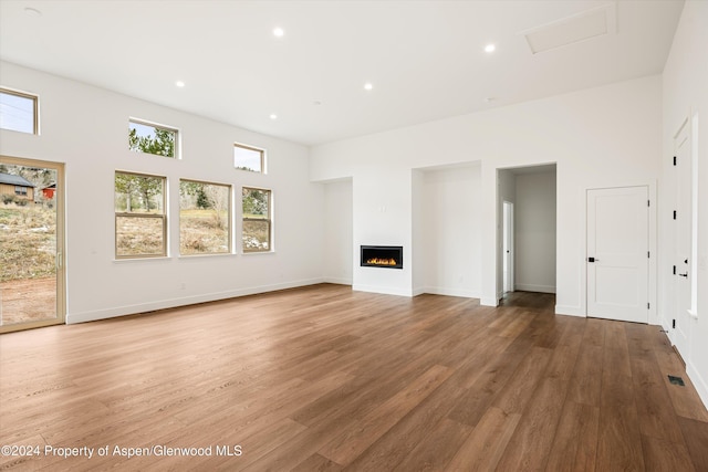 unfurnished living room featuring wood-type flooring