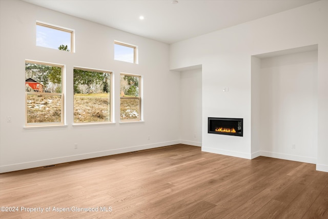 unfurnished living room featuring light hardwood / wood-style flooring