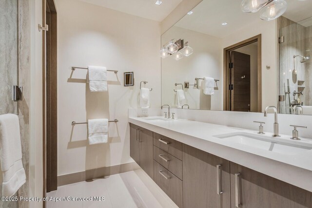 700 W Smuggler St, Aspen, CO 81611 - bathroom with double vanity and an enclosed shower