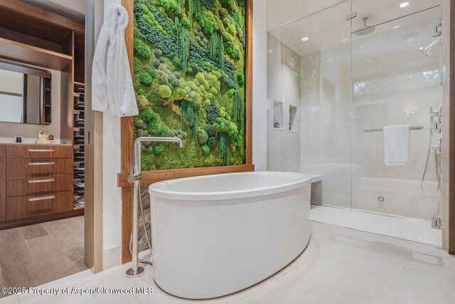700 W Smuggler St, Aspen, CO 81611 - full bath featuring a stall shower, vanity, and a freestanding bath