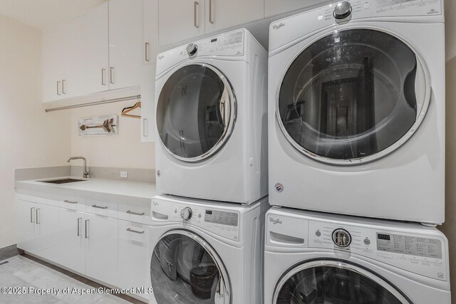 700 W Smuggler St, Aspen, CO 81611 - laundry area with stacked washing machine and dryer and cabinet space