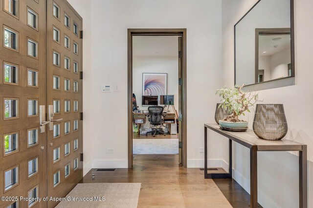 700 W Smuggler St, Aspen, CO 81611 - entryway with dark wood finished floors and french doors