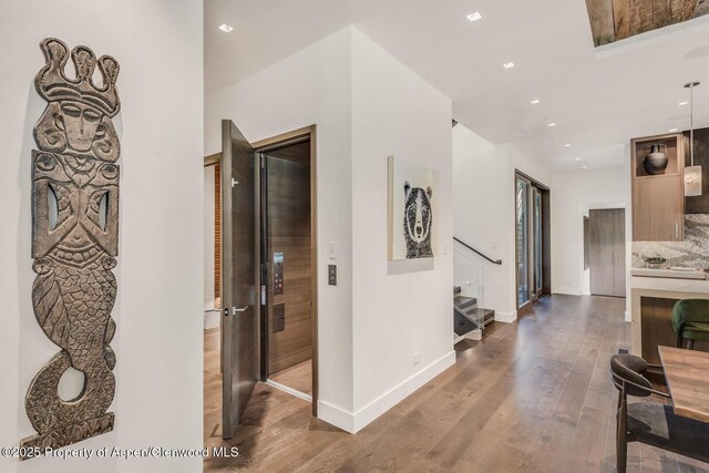 700 W Smuggler St, Aspen, CO 81611 - hall with wood finished floors, stairway, and recessed lighting