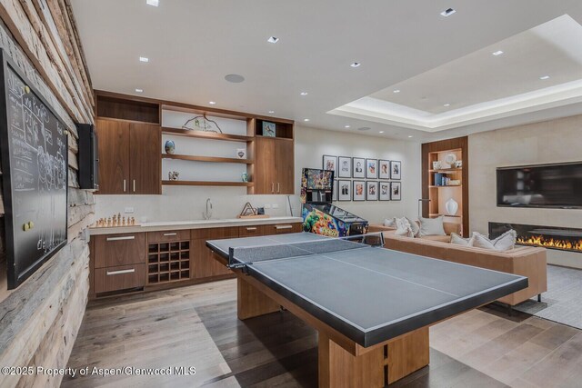 700 W Smuggler St, Aspen, CO 81611 - recreation room featuring light wood-type flooring, recessed lighting, and a fireplace