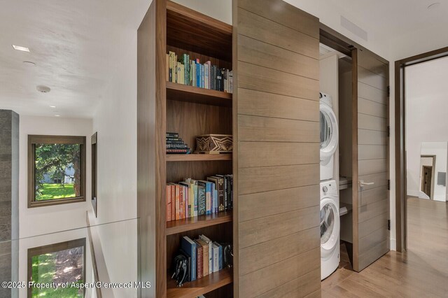 700 W Smuggler St, Aspen, CO 81611 - laundry room with stacked washer / drying machine and wood finished floors