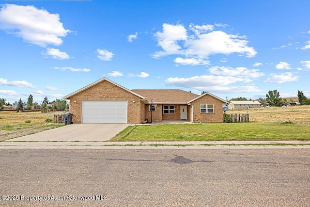 3695 W W 6th St, Craig, CO 81625 - single story home with brick siding, an attached garage, and concrete driveway