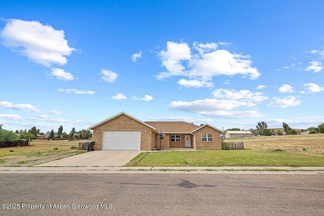 3695 W W 6th St, Craig, CO 81625 - ranch-style house with a garage, concrete driveway, and brick siding