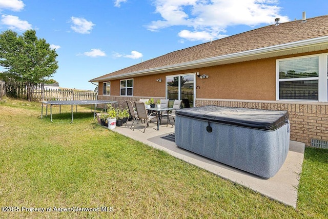 3695 W W 6th St, Craig, CO 81625 - view of yard featuring a hot tub, a trampoline, and a patio