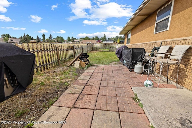 3695 W W 6th St, Craig, CO 81625 - fenced backyard featuring a patio area and grilling area