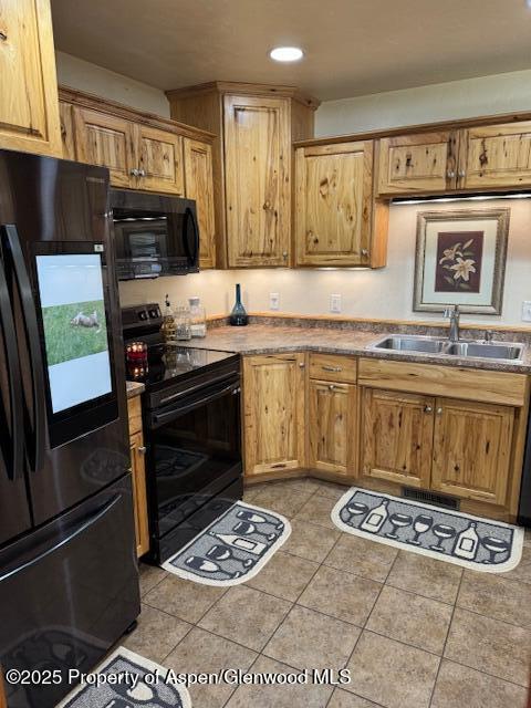 3695 W W 6th St, Craig, CO 81625 - kitchen featuring black appliances, a sink, recessed lighting, and light tile patterned flooring