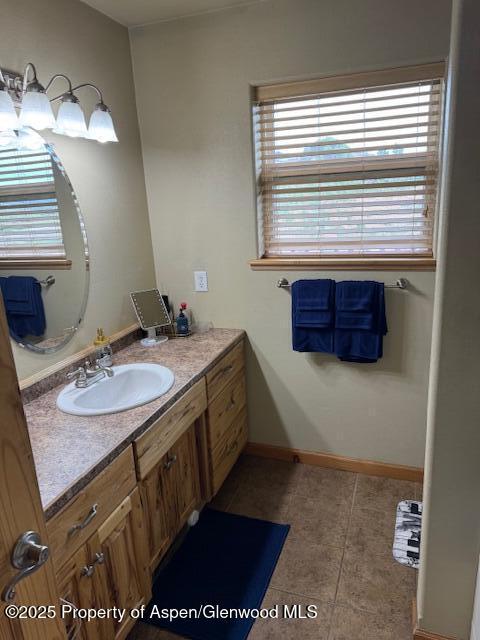 3695 W W 6th St, Craig, CO 81625 - bathroom with vanity, tile patterned flooring, and baseboards