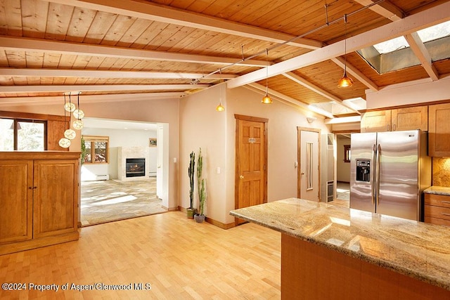 kitchen with light stone countertops, stainless steel fridge with ice dispenser, wood ceiling, and lofted ceiling with beams