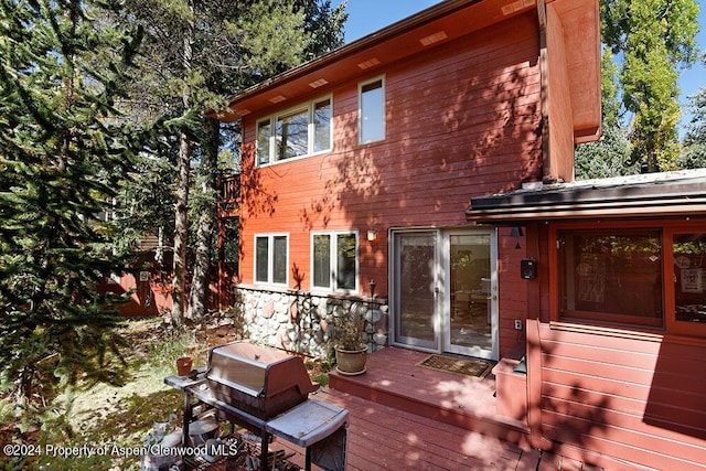 wooden deck with grilling area