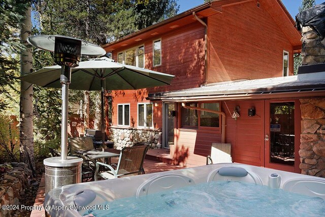 view of patio with a hot tub