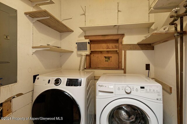 washroom with washer and dryer and electric panel