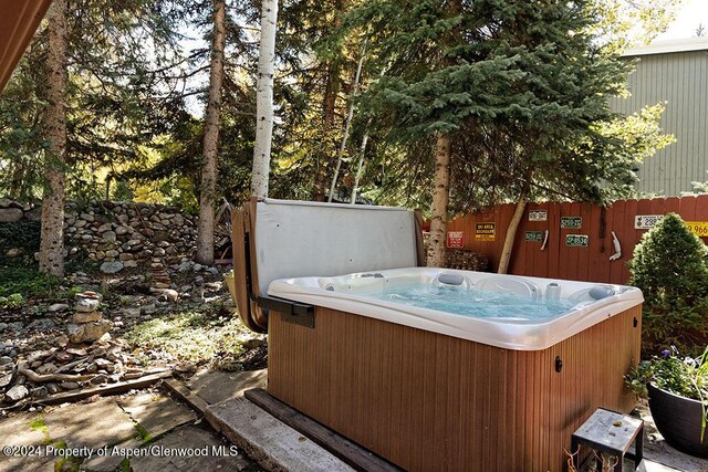 view of patio / terrace featuring a hot tub