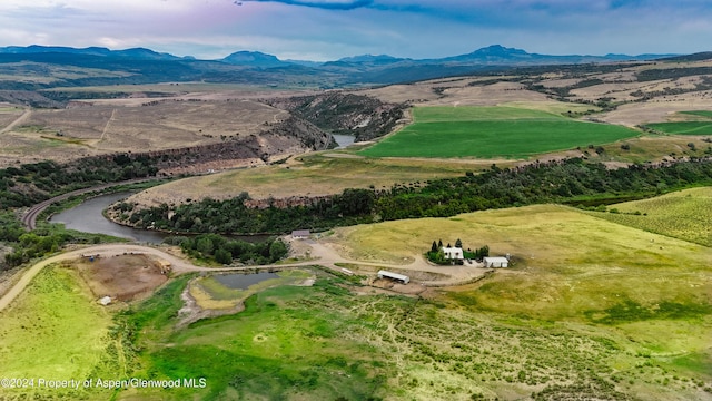 birds eye view of property with a mountain view