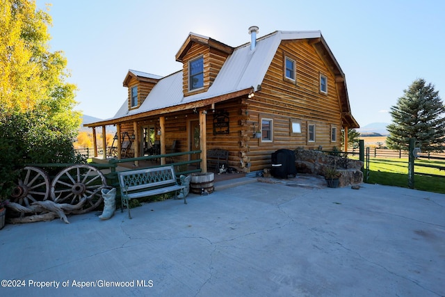 back of house with a porch