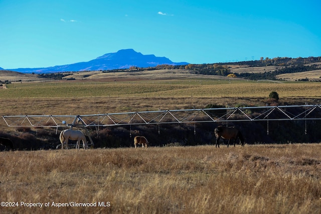 property view of mountains featuring a rural view