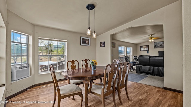 160 Mustang Mesa Trl, Rifle, CO 81650 - dining room with wood finished floors, plenty of natural light, a ceiling fan, and cooling unit