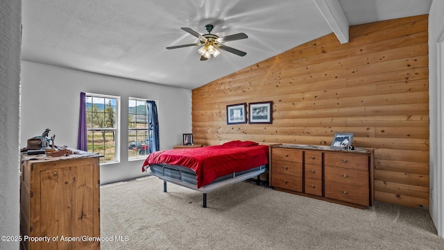 160 Mustang Mesa Trl, Rifle, CO 81650 - carpeted bedroom featuring a ceiling fan and wooden walls