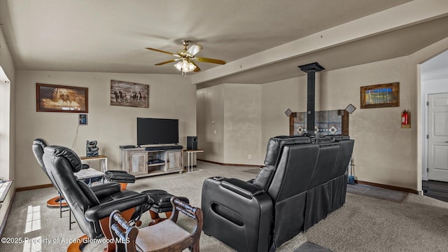 160 Mustang Mesa Trl, Rifle, CO 81650 - living room with ceiling fan, light colored carpet, and a wood stove