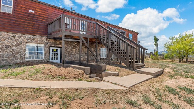 160 Mustang Mesa Trl, Rifle, CO 81650 - exterior space with stone siding and a deck