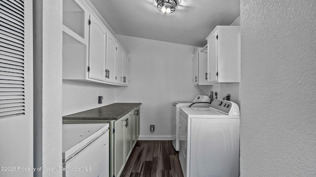 160 Mustang Mesa Trl, Rifle, CO 81650 - washroom featuring cabinet space, a heating unit, washer and dryer, dark wood-style floors, and a textured wall