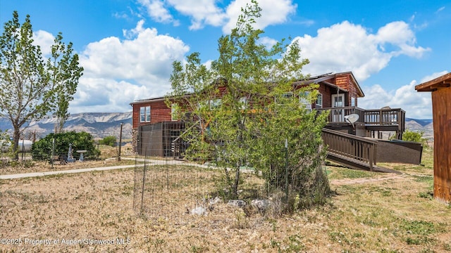 160 Mustang Mesa Trl, Rifle, CO 81650 - rear view of house featuring a deck with mountain view