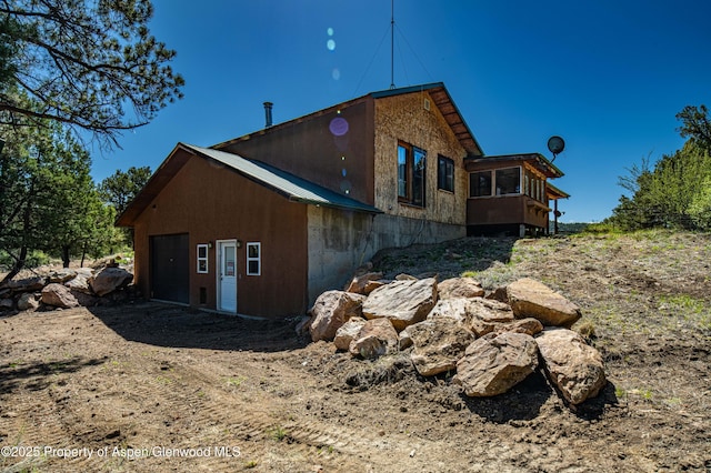 701/700 Bella Vista Ln, Cotopaxi, CO 81223 - view of side of home featuring metal roof