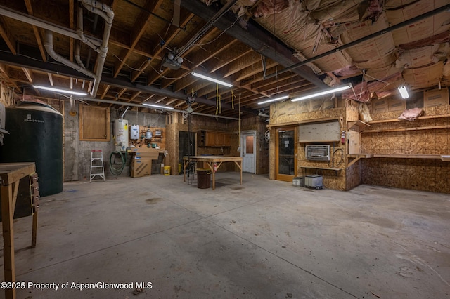 701/700 Bella Vista Ln, Cotopaxi, CO 81223 - basement featuring a workshop area and water heater